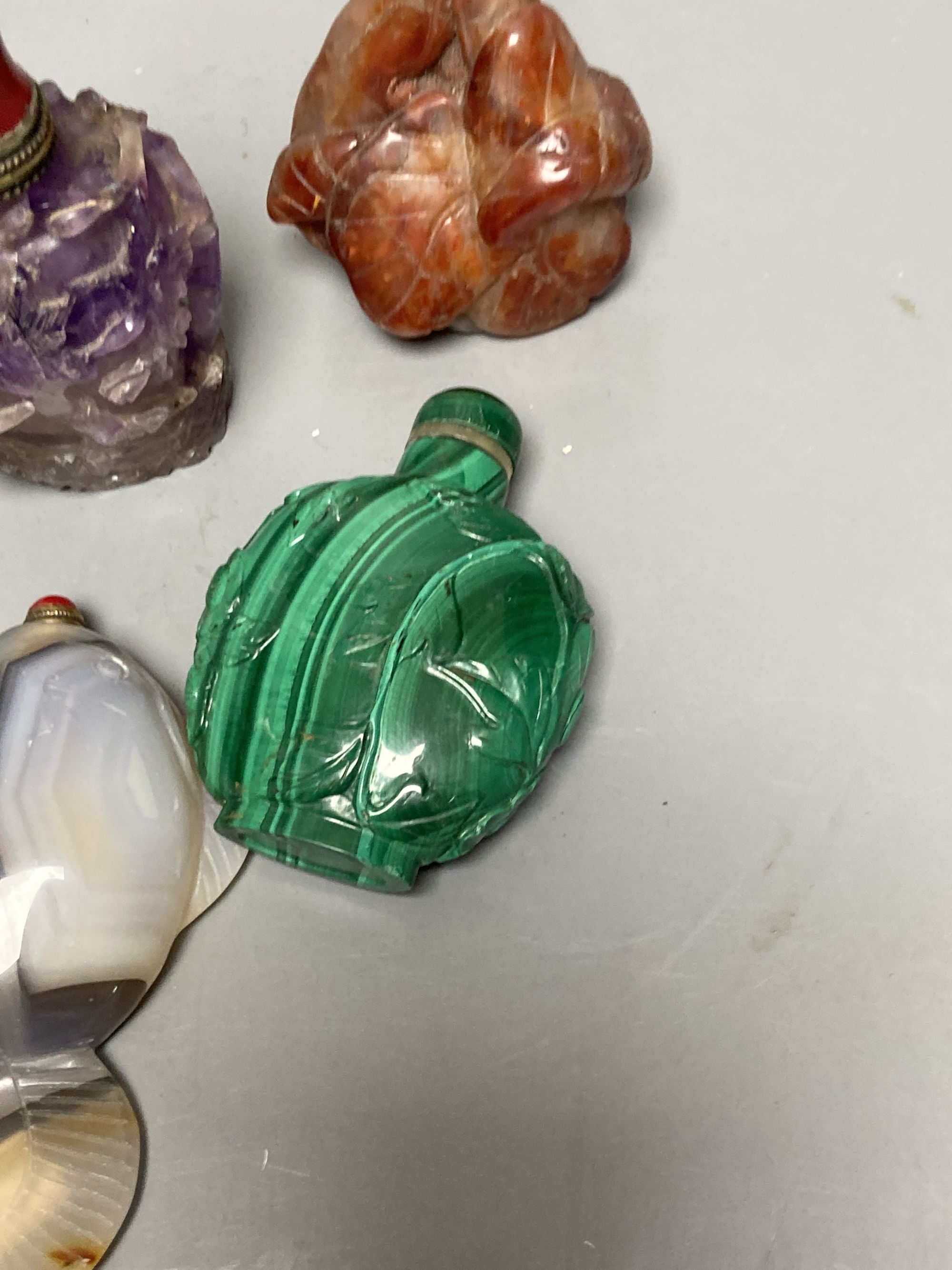 Five Chinese carved hardstone snuff bottles